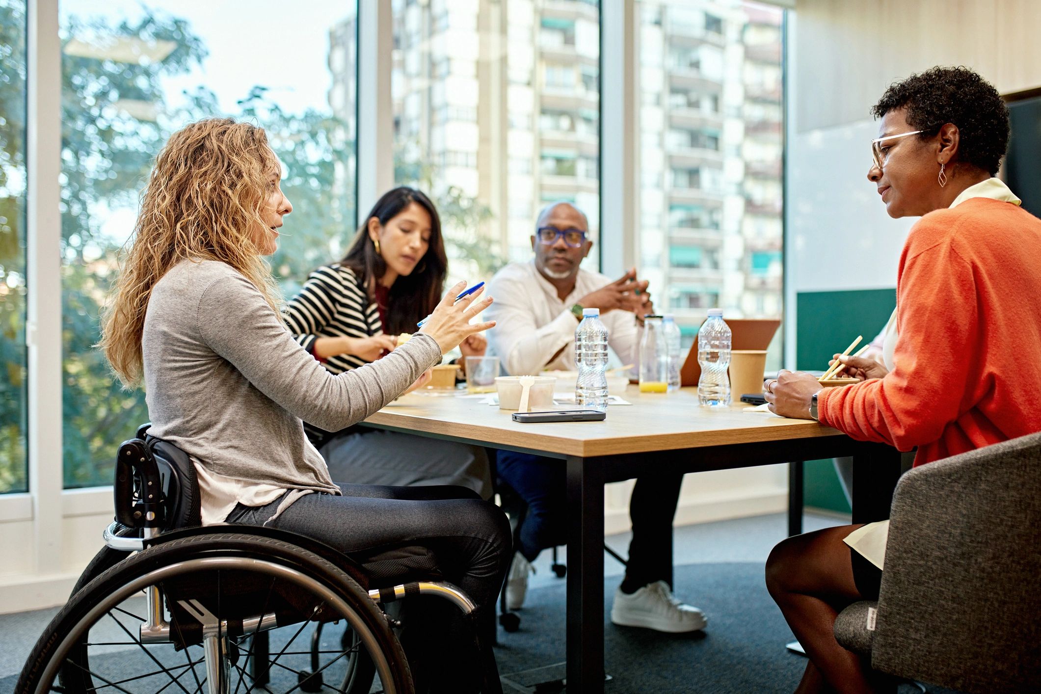 Community members collaborating around a table